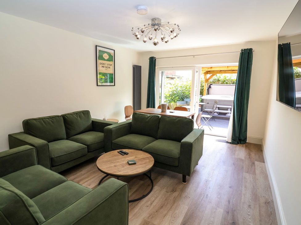 A living room with a sofa and coffee table at 2 Rookery Close in Nantwich