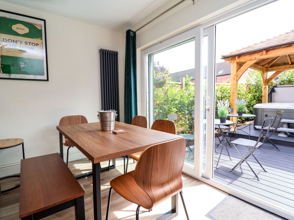 A dining room with a table and chairs at 2 Rookery Close Nantwich