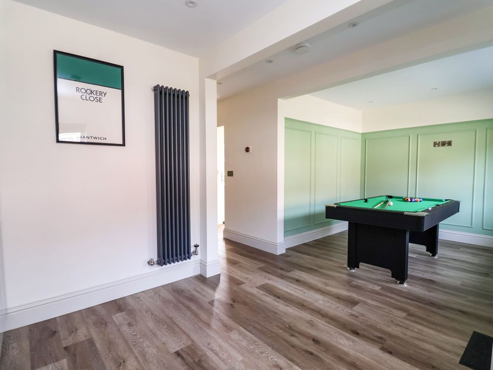 A game room with a pool table at 2 Rookery Close in Nantwich