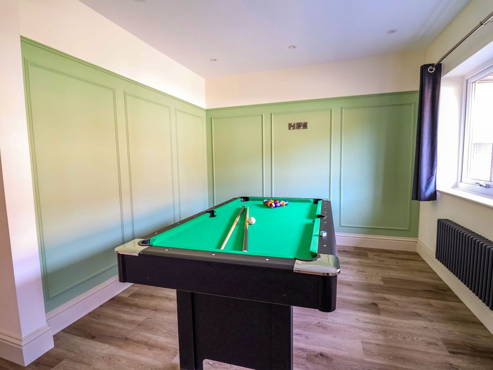 A game room with a pool table at 2 Rookery Close in Nantwich