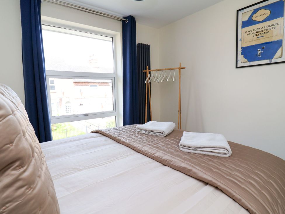 A bedroom with a bed and towels on it at 2 Rookery Close Nantwich