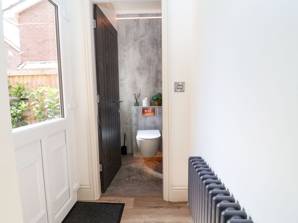 A bathroom with a toilet and washbasin at 2 Rookery Close Nantwich