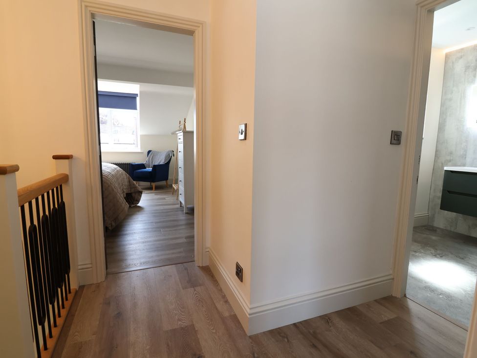 A hallway with doors leading to a bedroom and bathroom at 2 Rookery Close in Nantwich
