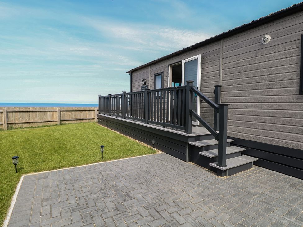 An outdoor area with a deck and stairs at Plot 34 in Bacton