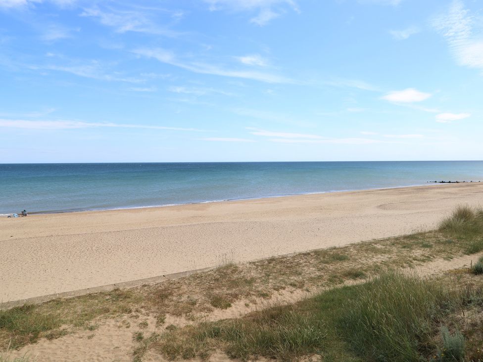 A beach with sand and ocean at Plot 34, Bacton
