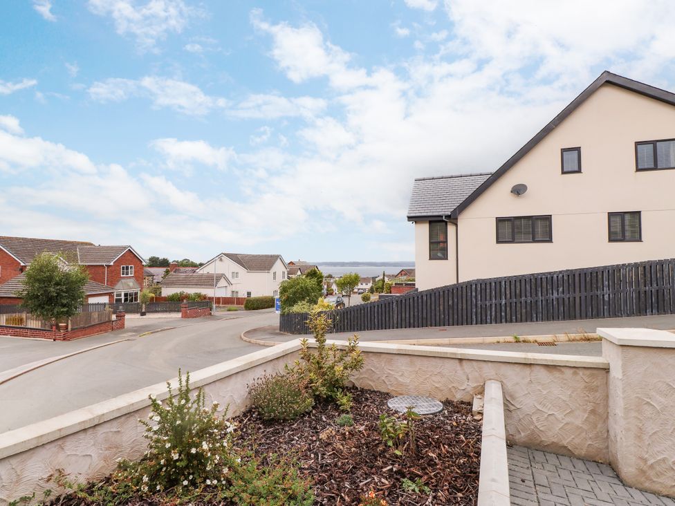 A view of houses and road from a residential area at 95 Cae America Llanfairfechan
