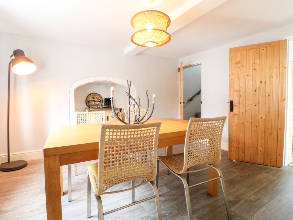 A dining room with a table and chairs at Next Door No. 4 in Coalville