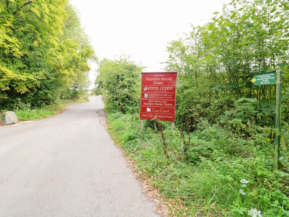 A road with signs and trees at Staunton Harold Estate in Coalville
