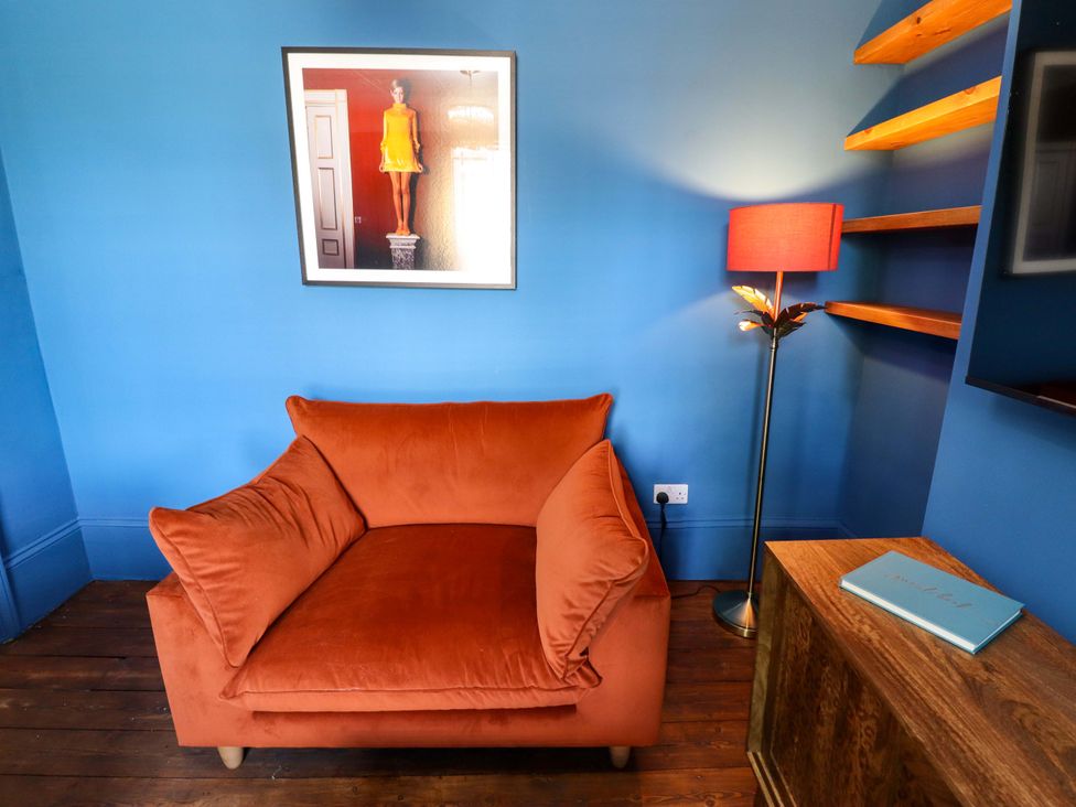 A snug with an armchair and lamp at 35 Wrawby Street in Brigg