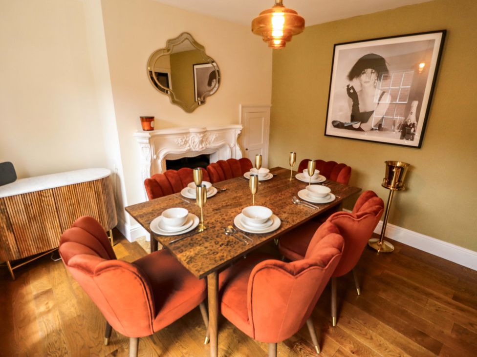 A dining room with a table set for meals at 35 Wrawby Street in Brigg