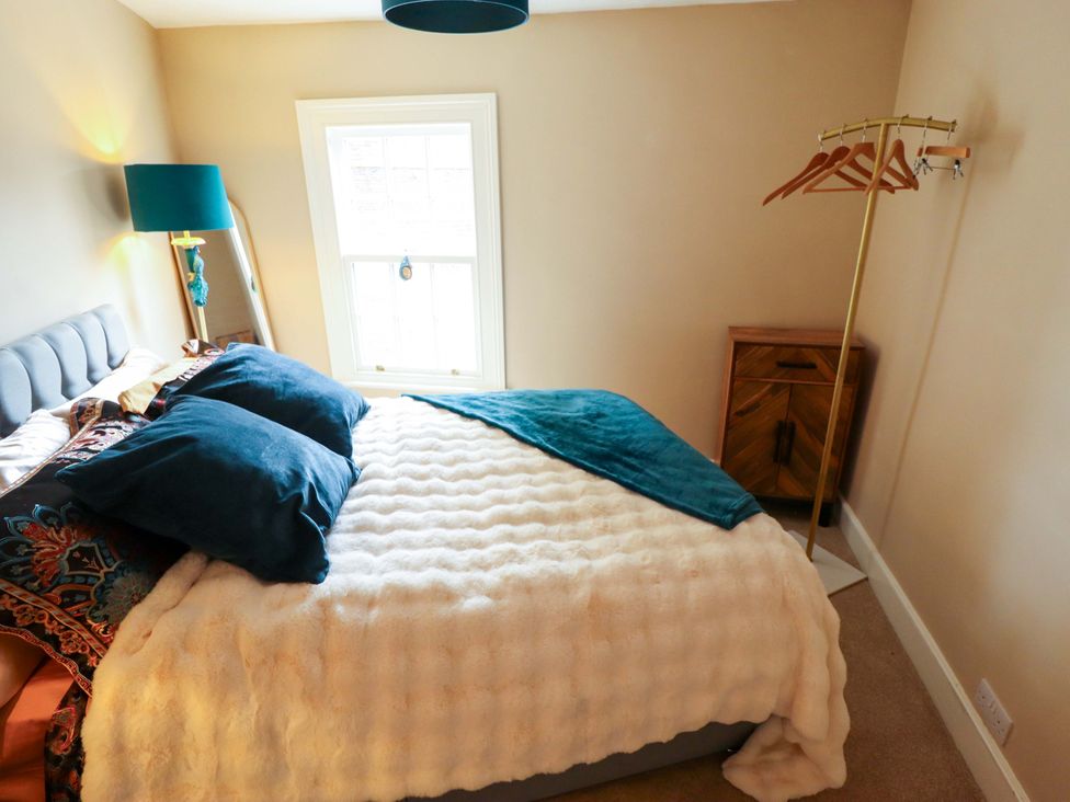 A bedroom with a bed and pillows at 35 Wrawby Street in Brigg
