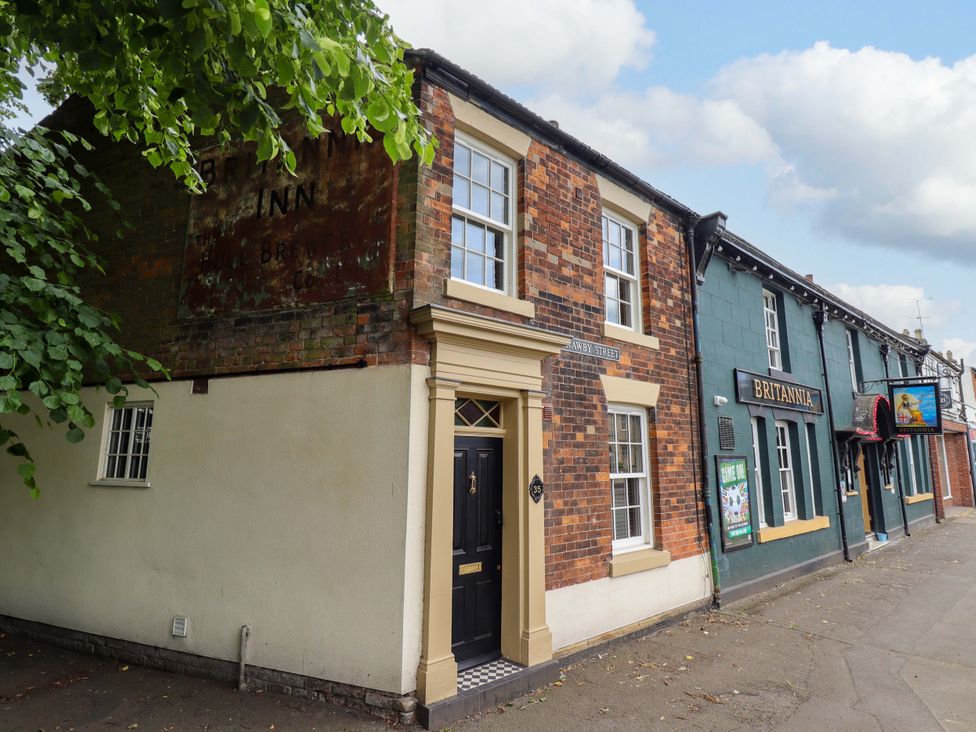 A building exterior with a door and windows at 35 Wrawby Street Brigg