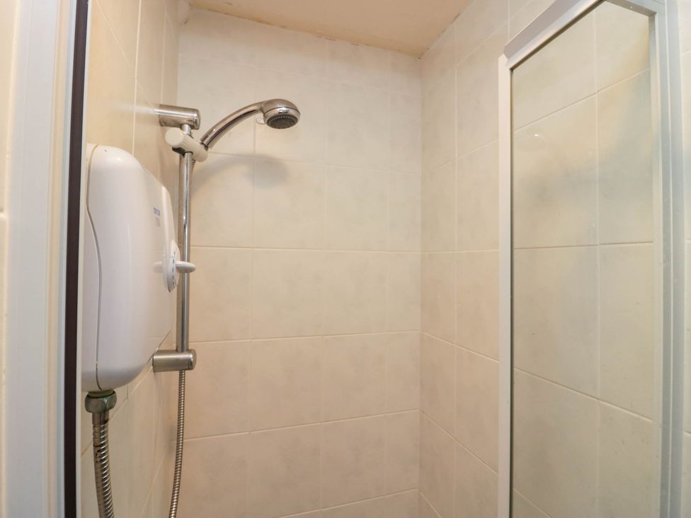 A shower with a showerhead and control in Flat 4 Grasmere Lodge Ambleside