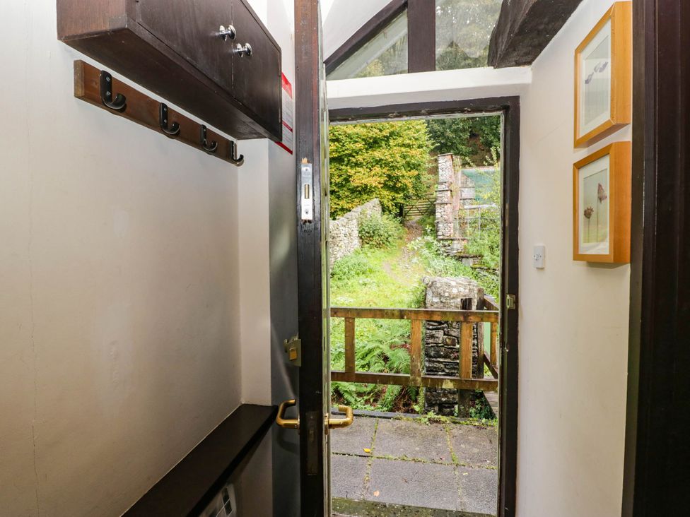 An entrance with a door and coat hooks at Dunmail Raise, Grasmere Lodge