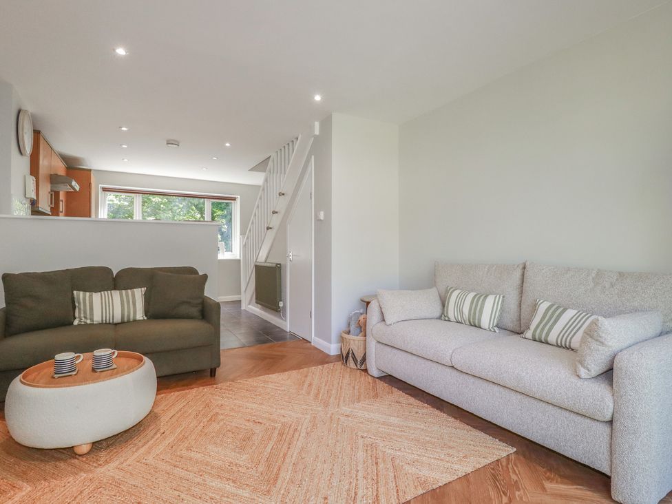 A living room with a sofa and coffee table at 67 Manor Villas in Newquay
