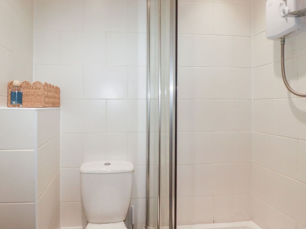 A bathroom with a toilet and shower at 67 Manor Villas in Newquay