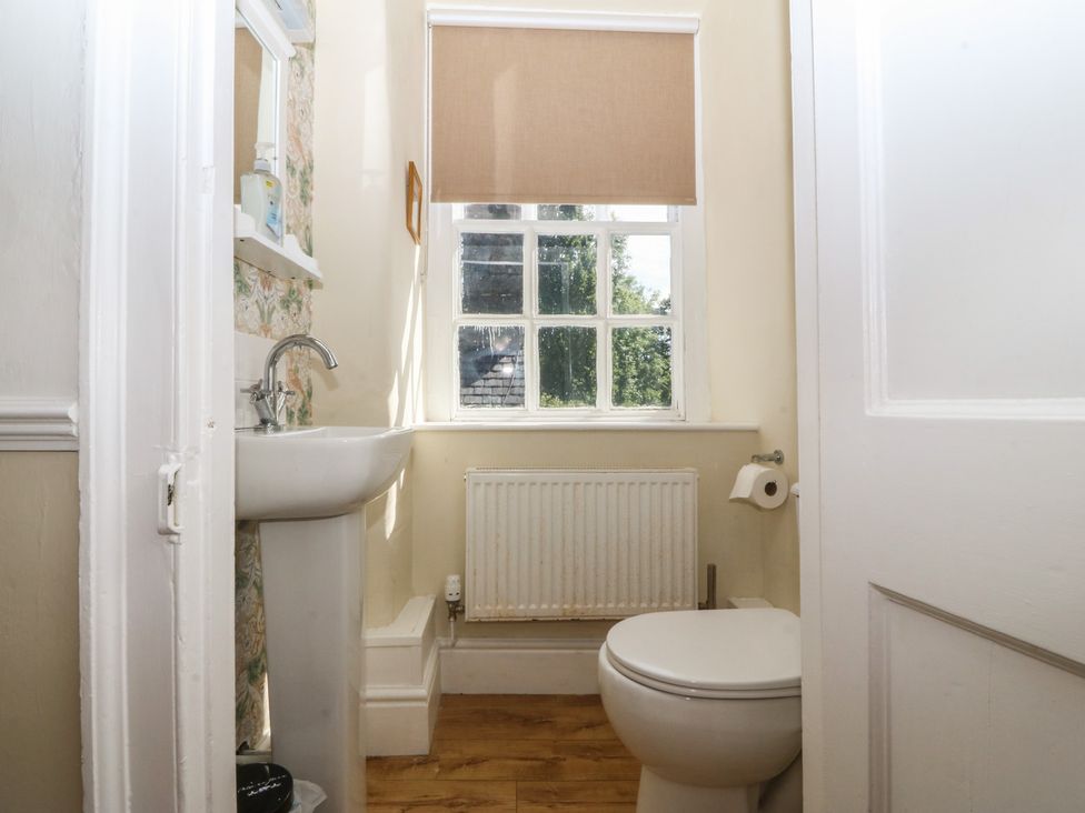 A bathroom with a sink and toilet at Tan y Gader in Dolgellau
