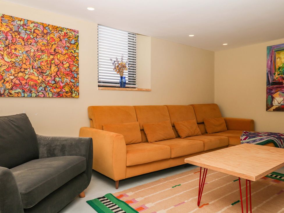 A living room with a couch and coffee table at Reddaway Byre Okehampton