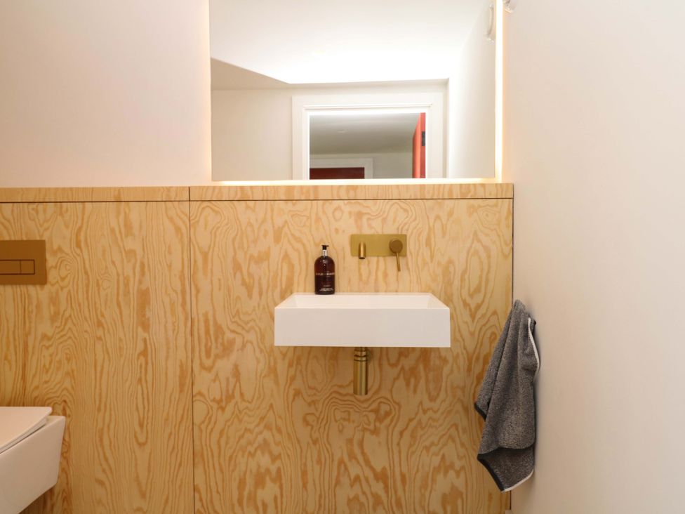 A bathroom with a sink and towel at Reddaway Byre Okehampton