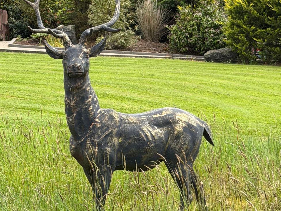 A deer statue in a garden at Alken The Stag, Bushmills, County Antrim