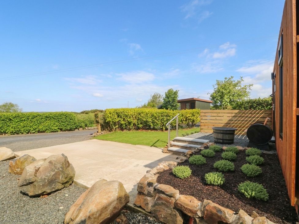 An outdoor space with a pathway and plants at Alken The Stag in Bushmills, County Antrim