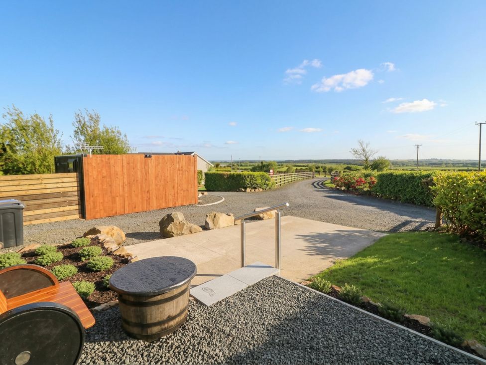 An outdoor area with a gravel path and wooden fence at Alken The Stag Bushmills, County Antrim