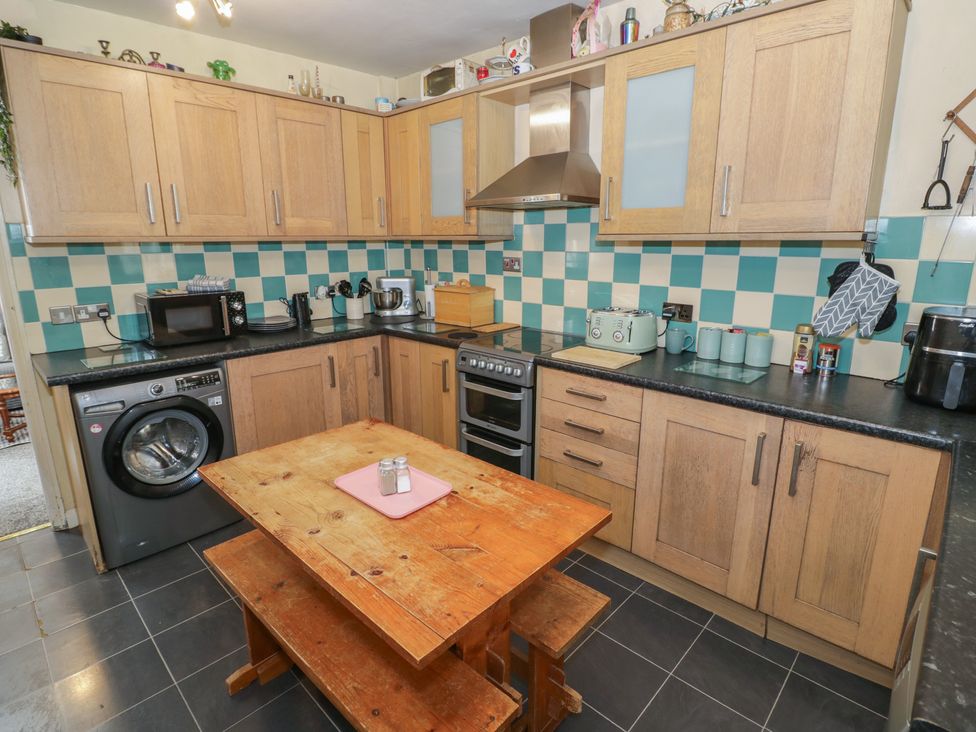 A kitchen with a table and chairs at Mount Joy in Leicester