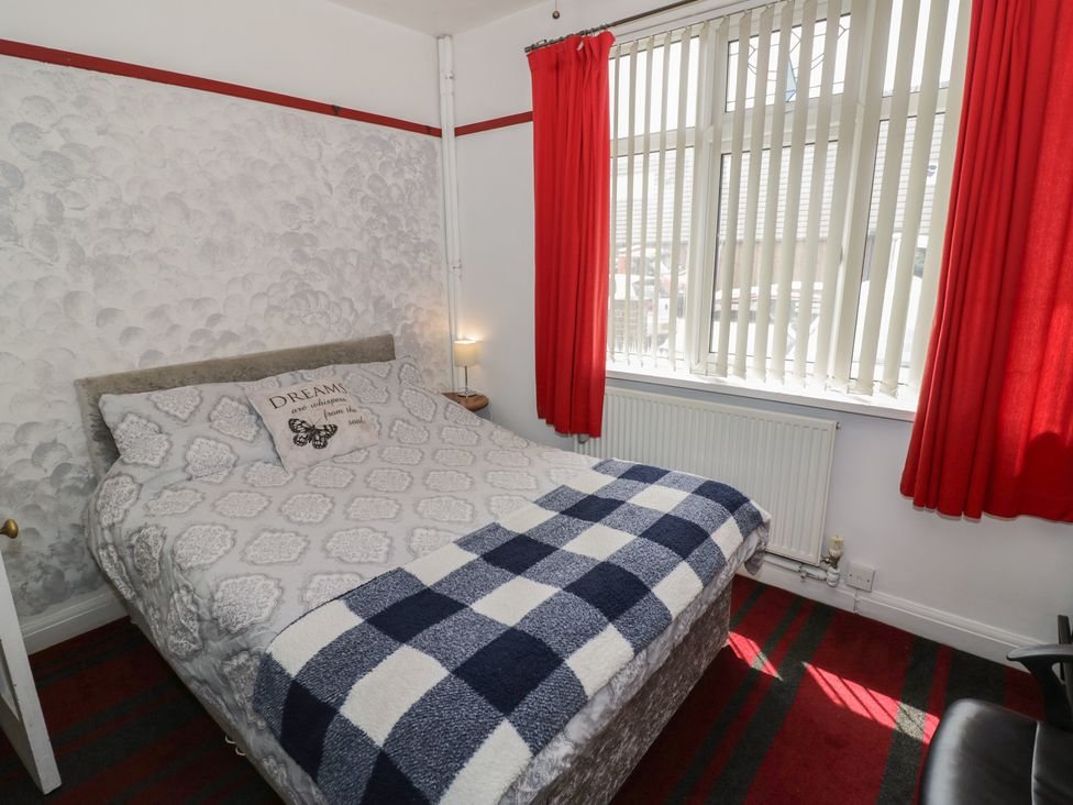 A bedroom with a bed and window at Mount Joy in Leicester