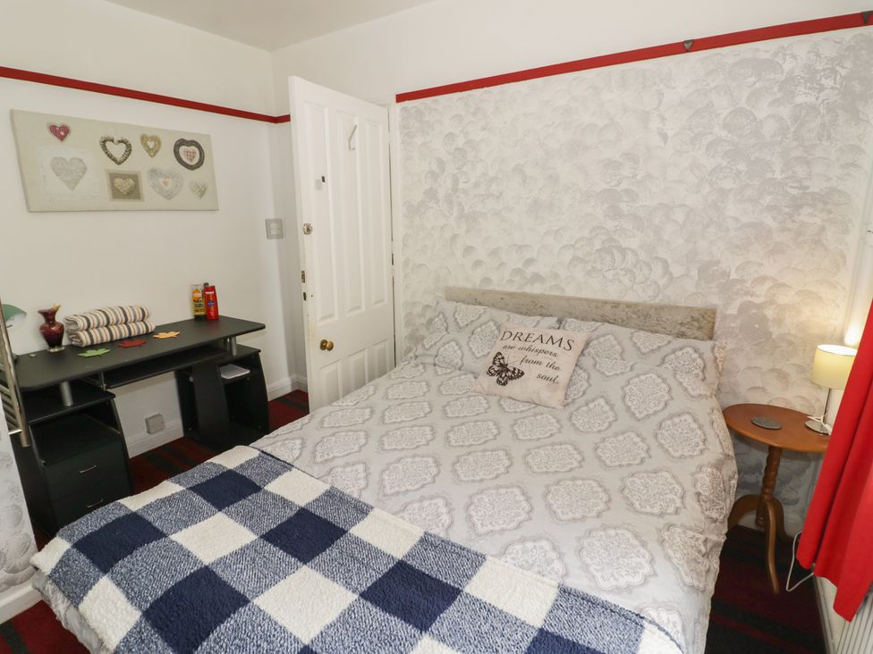 A bedroom with a bed and desk at Mount Joy in Leicester