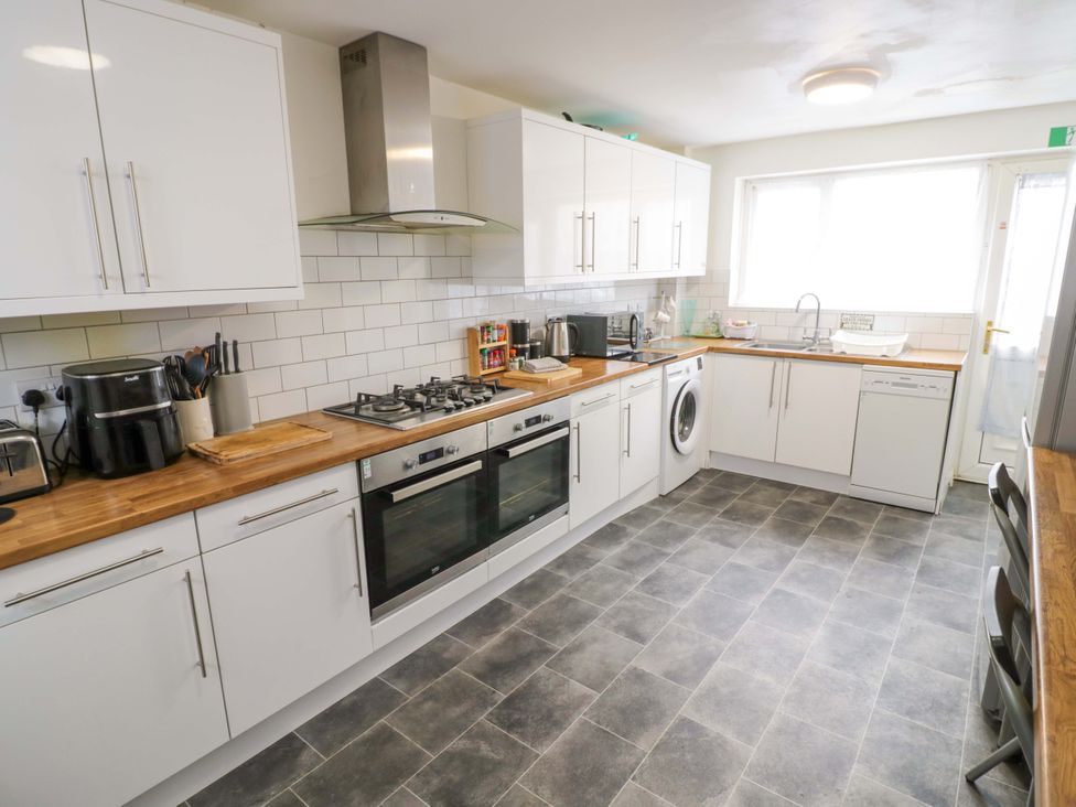 A kitchen with appliances and countertops at 9 Uist Walk in Corby
