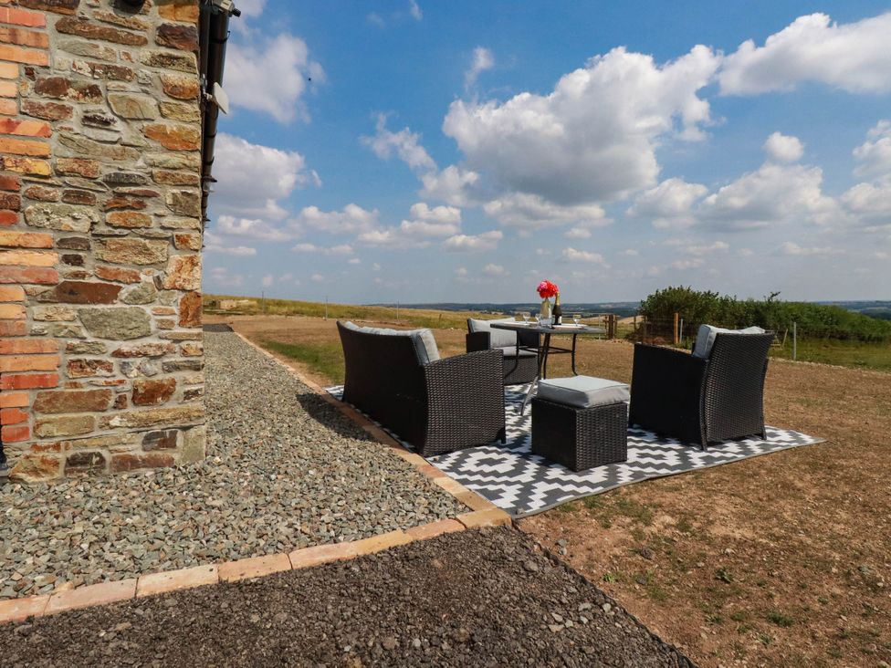 An outdoor seating area with furniture and a table at The Granary in Launceston