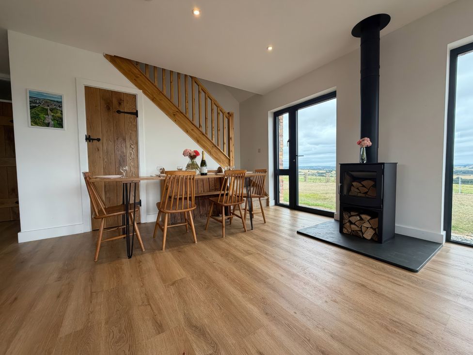 A dining room with a table and chairs at Up Top in Launceston