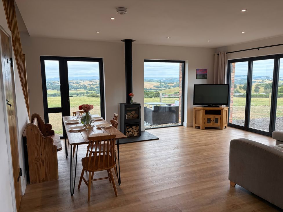 A dining room with a table and chairs at Up Top in Launceston