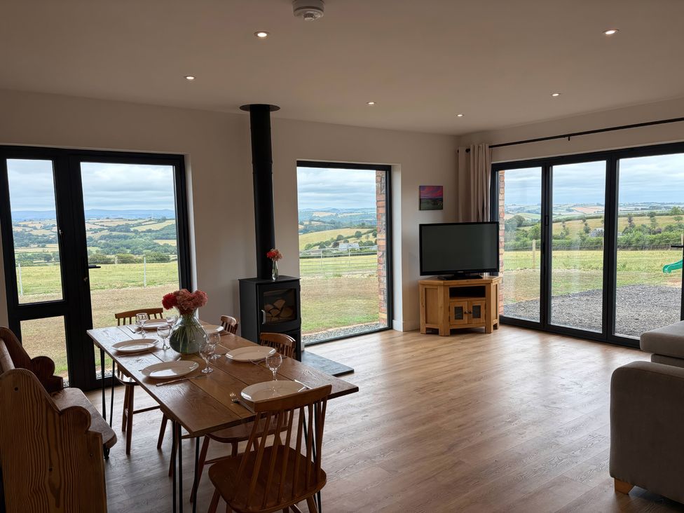 A dining room with a table and chairs at Up Top in Launceston