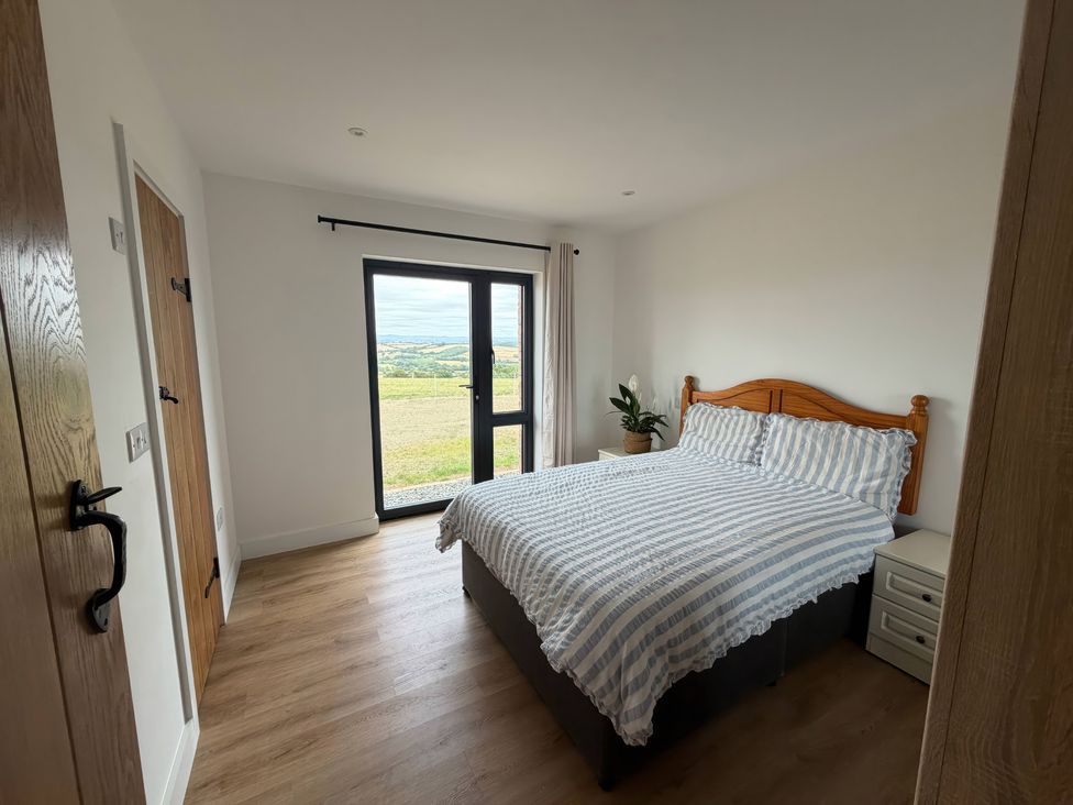 A bedroom with a bed and a plant at Up Top in Launceston
