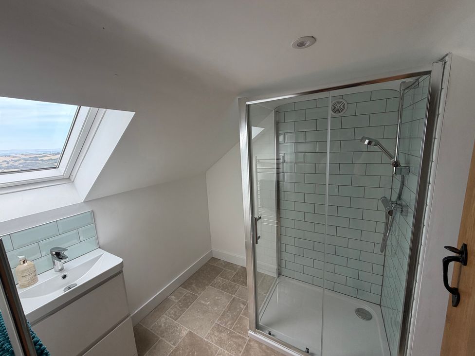 A bathroom with a shower and sink at High View Barn in Launceston