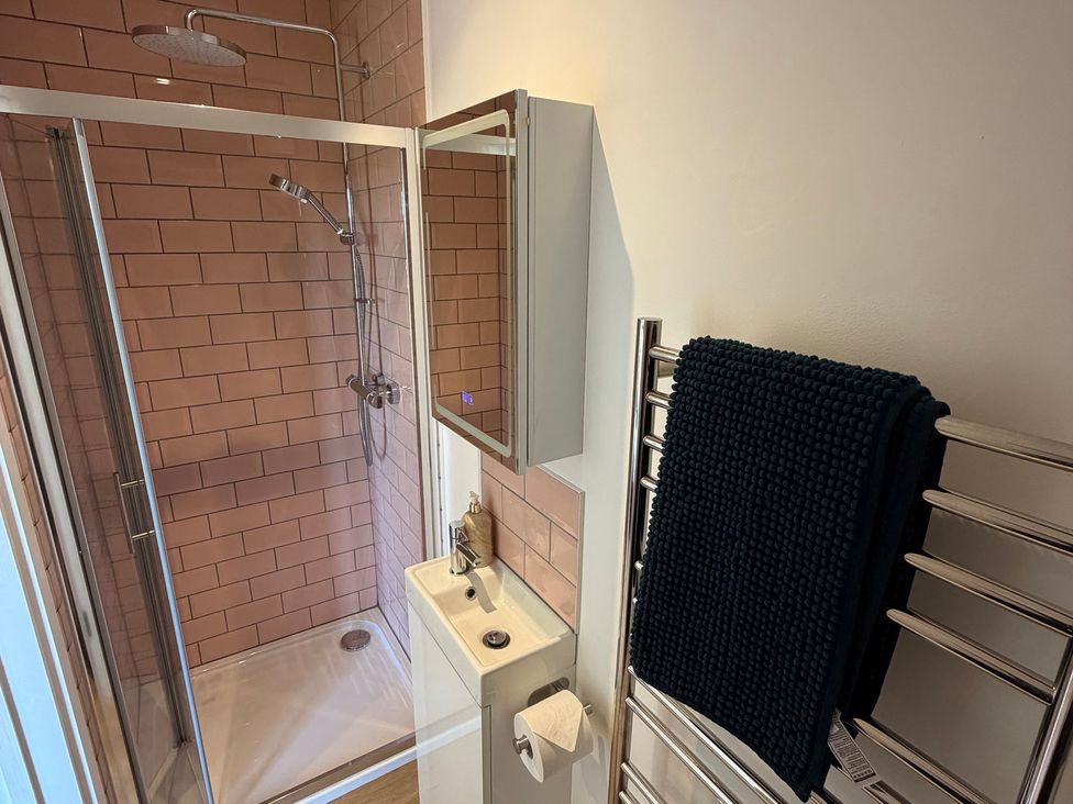 A bathroom with a shower and sink at High View Barn in Launceston