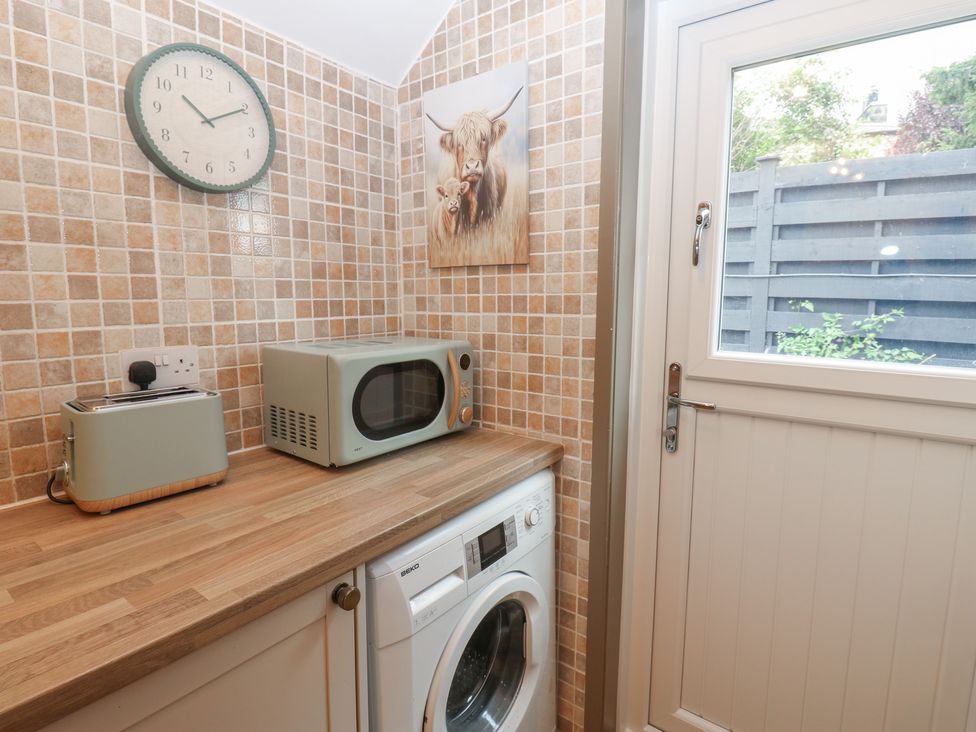 A utility room with appliances at Corner House in Wark