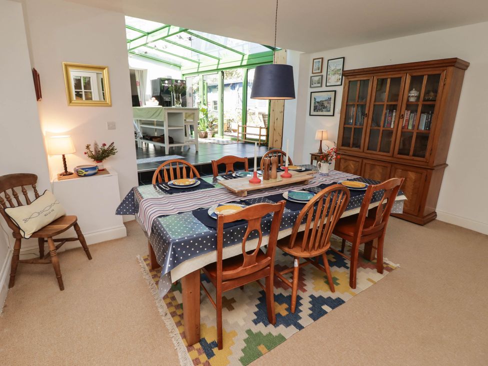 A dining room with a table and chairs at 11b Market Street Narberth