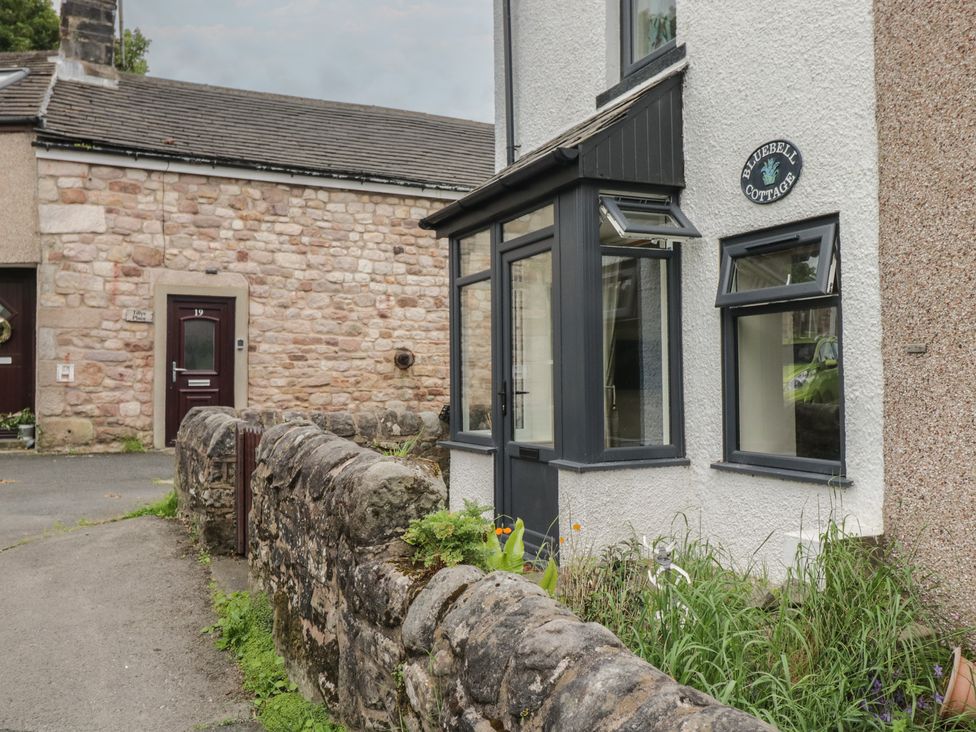 A view of Bluebell Cottage with stone wall at Bluebell Cottage in Heysham