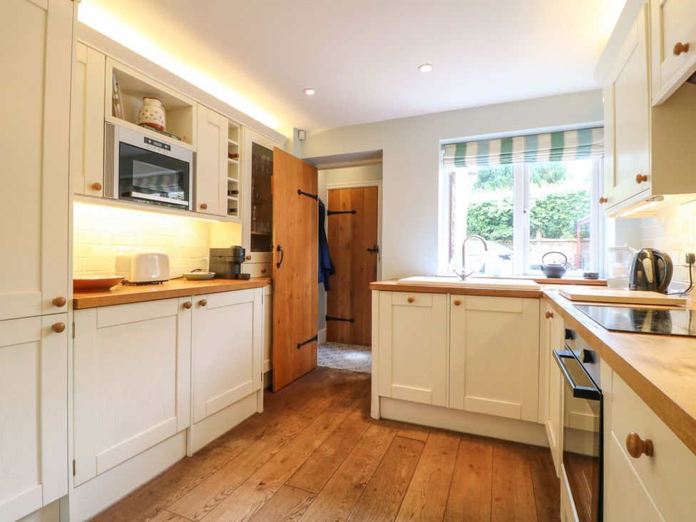 A kitchen with appliances and a window at The Chimes in Hope Valley