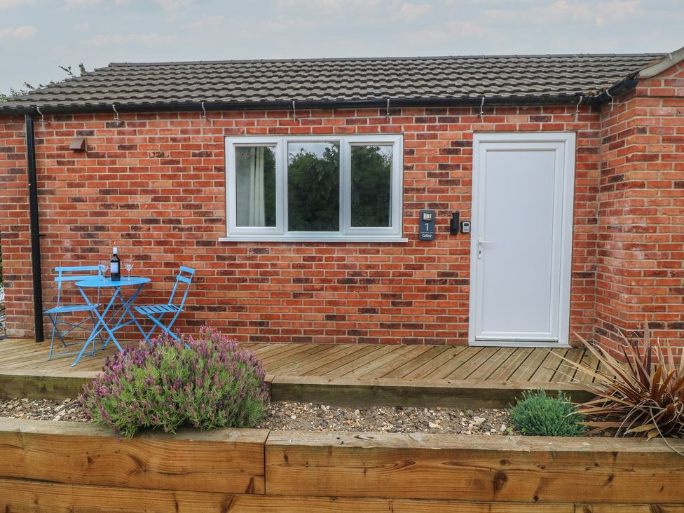 An outdoor area with a table and chairs at Catley, Billinghay, Lincolnshire