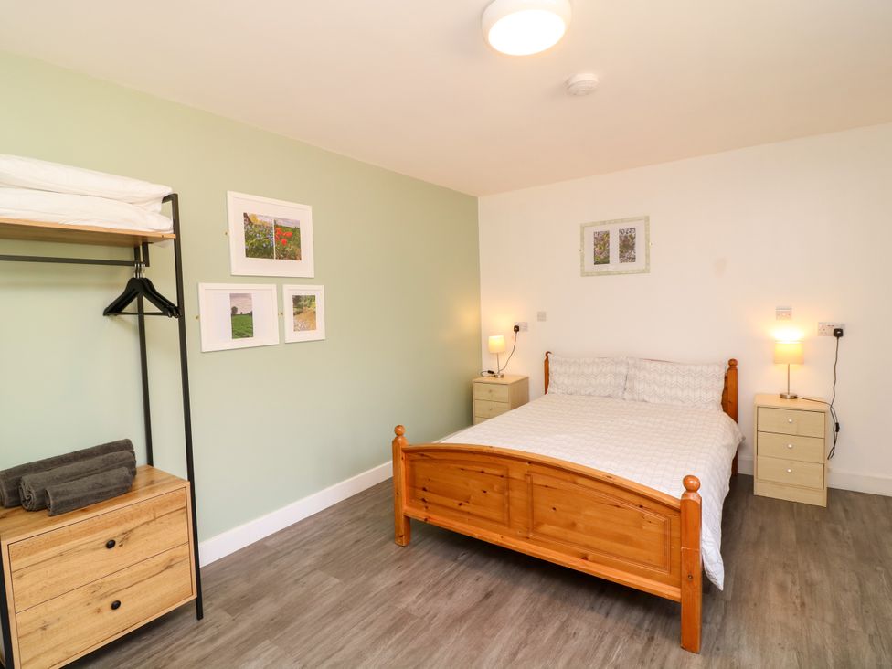 A bedroom with a bed and side tables at Walcott Lodges - Catley in Billinghay, Lincolnshire