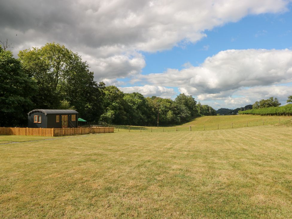 An outdoor area with a hut and grass at Cwtch Y Bugail 2 Near Llandeilo
