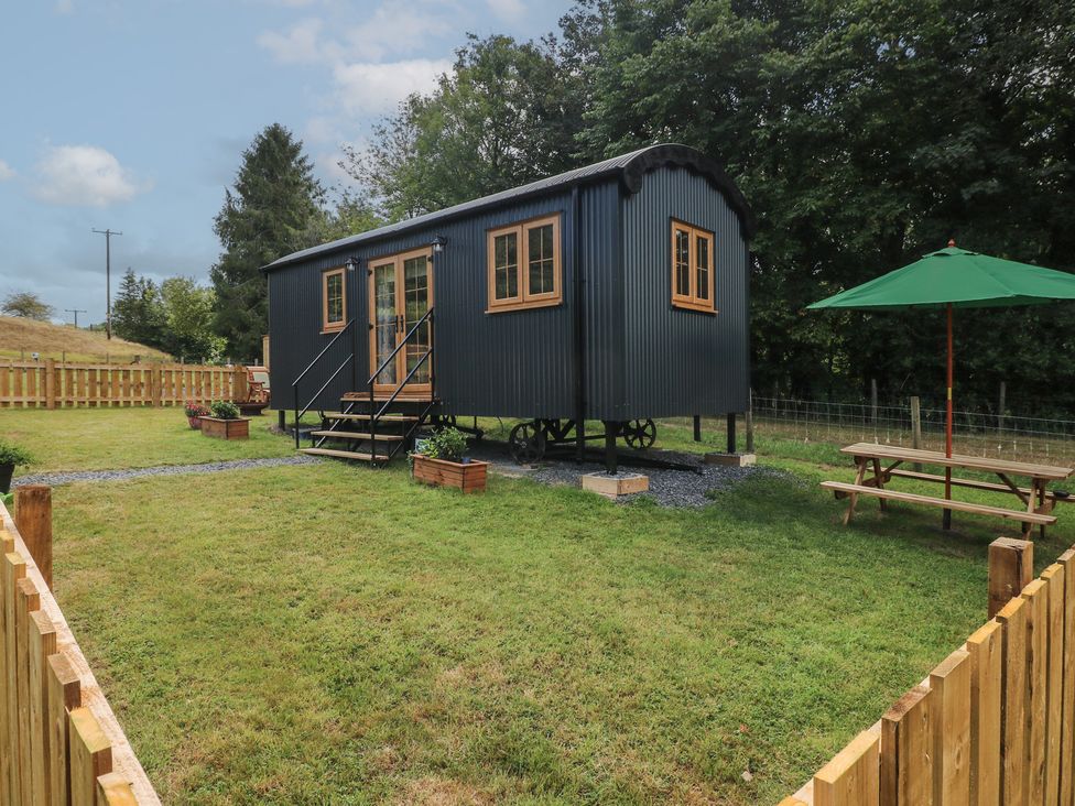 A tiny house with steps and a picnic table at Cwtch Y Bugail 2 Near Llandeilo