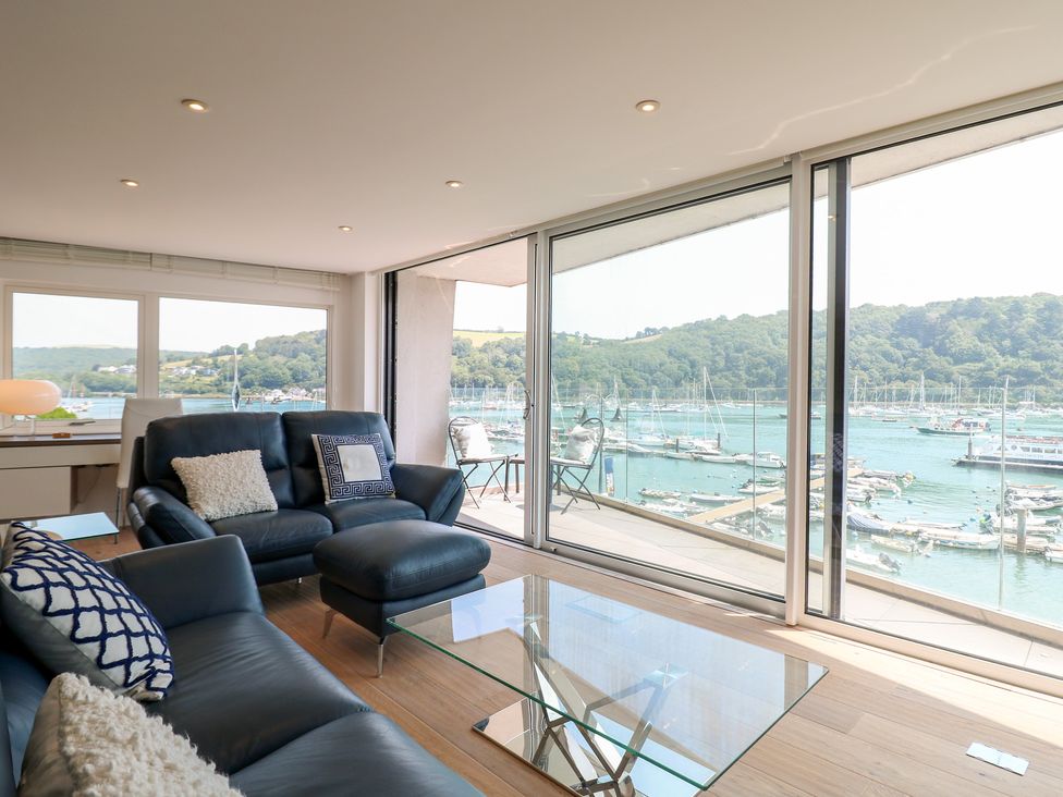 A living room with a view of the water at 5 Sails in Dartmouth