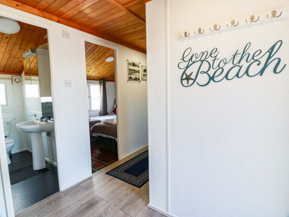 A hallway with a bathroom and bedroom entrance at Queensway QW1 in Dumfries