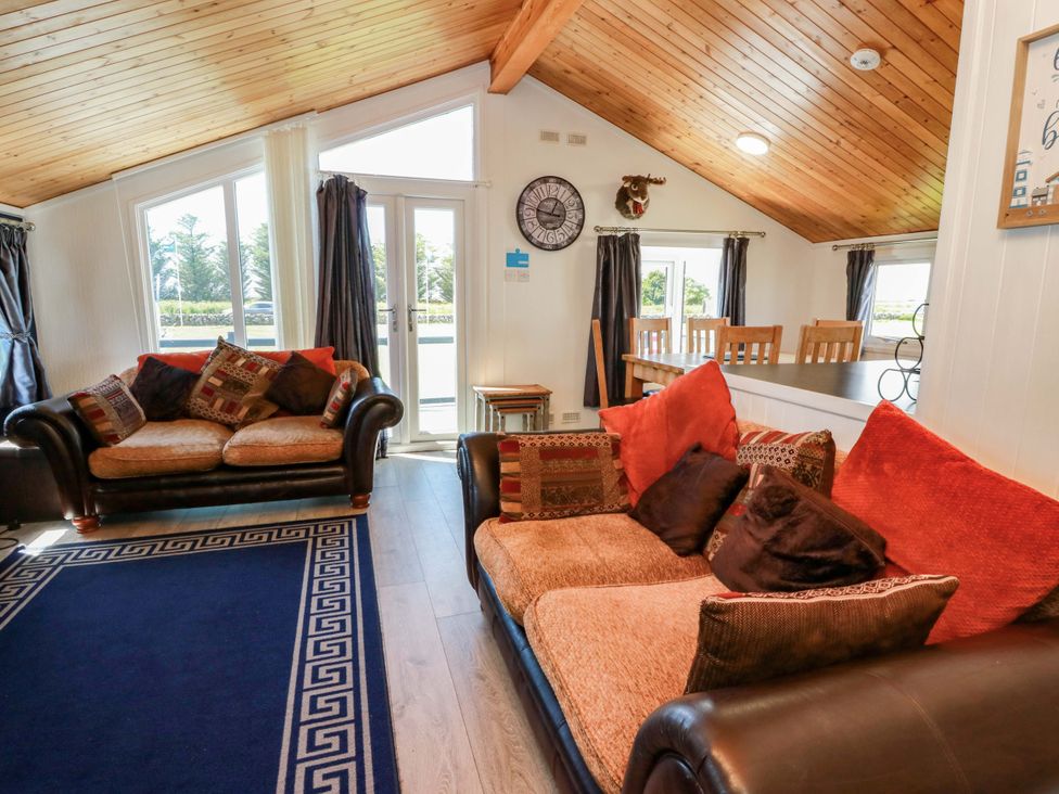 A living room with sofas and a dining table at Queensway QW1 Dumfries