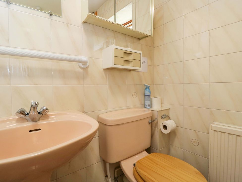 A bathroom with sink and toilet at The Garden Studio in Bremhill near Calne