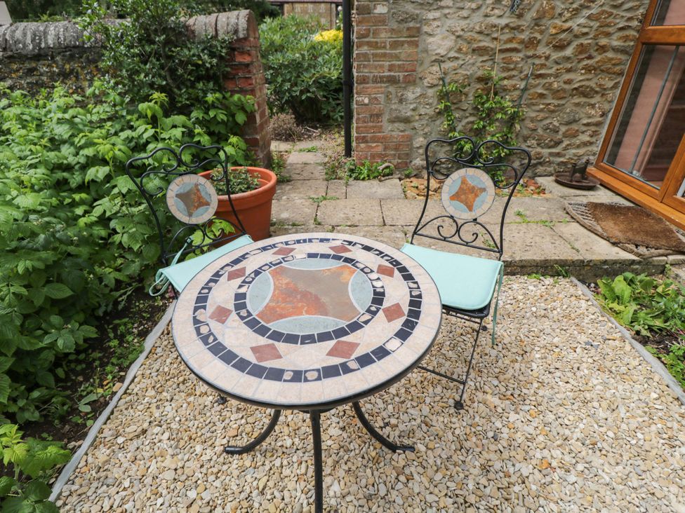 A table and chairs in a garden at The Garden Studio Bremhill near Calne